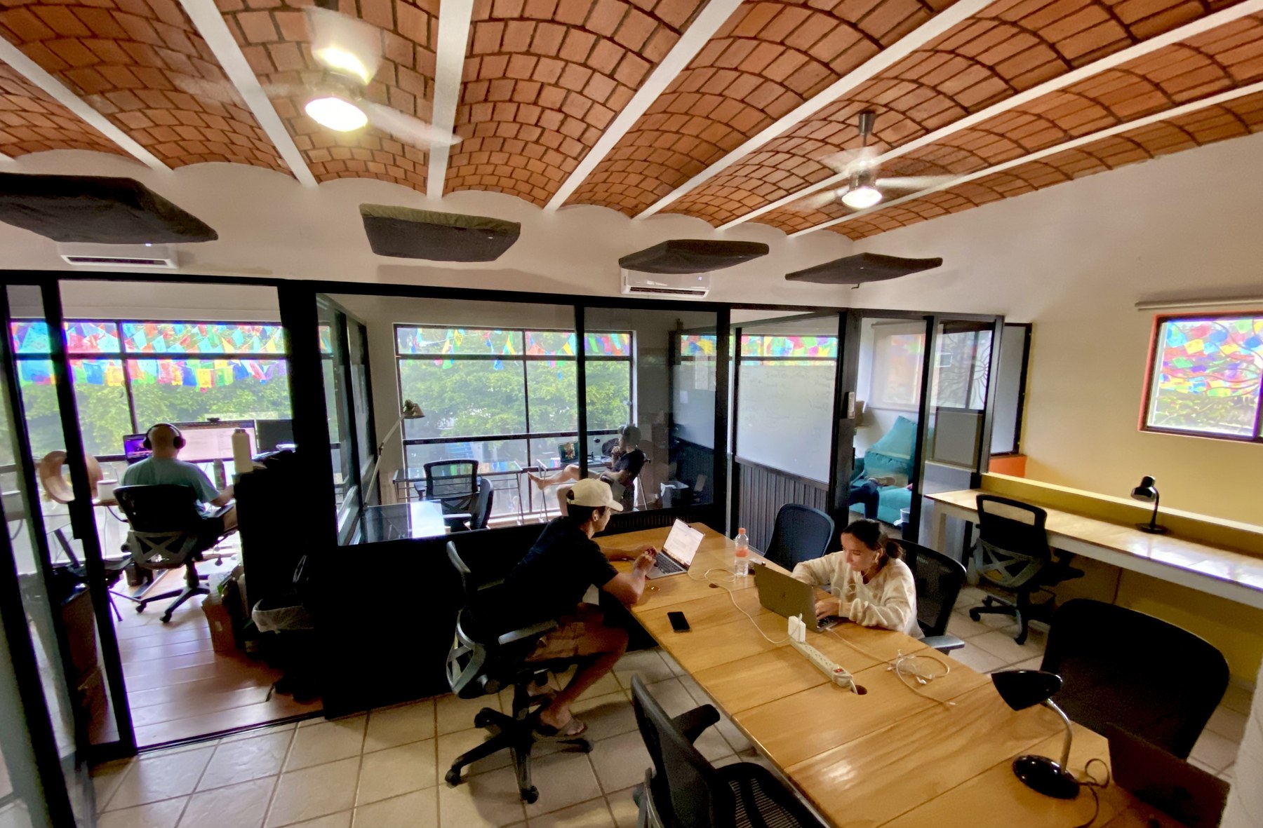 Current open workspace and glass offices at Sayulita Cowork